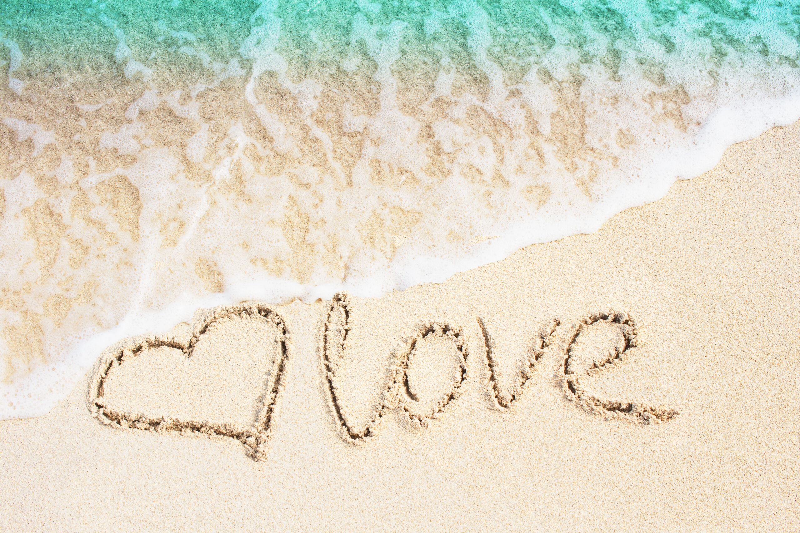 Love,And,Heart,Symbol,Handwritten,On,Tropical,Beach,With,Soft